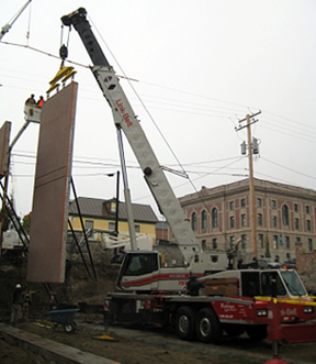 Crane lifting wall